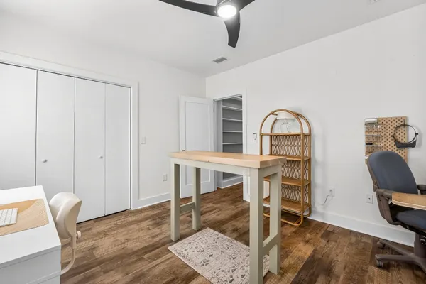 a view of a livingroom with furniture and staircase