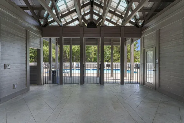 a view of an empty room with windows