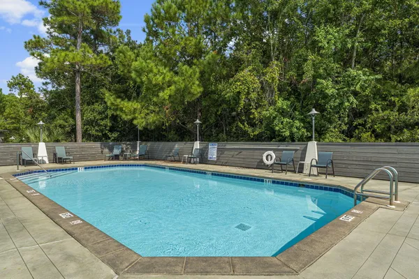 a view of a swimming pool with a lounge chair