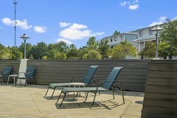 a backyard of a house with table and chairs