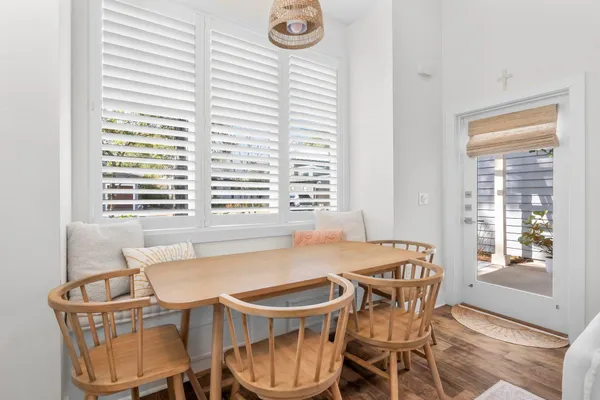 a dining room with furniture and window