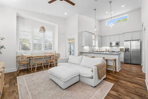 a living room with stainless steel appliances kitchen island granite countertop furniture and a kitchen view