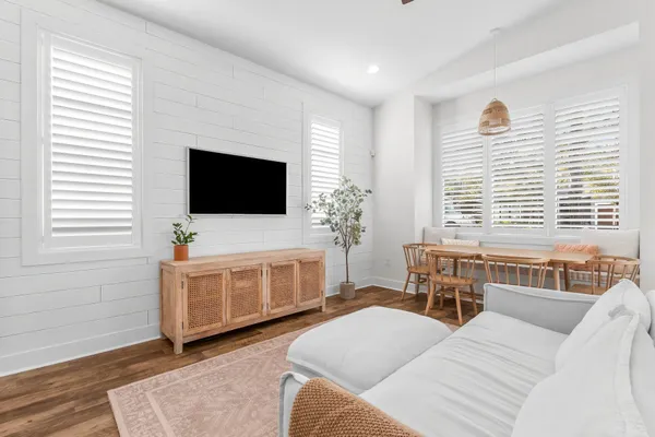 a bedroom with furniture and a flat screen tv