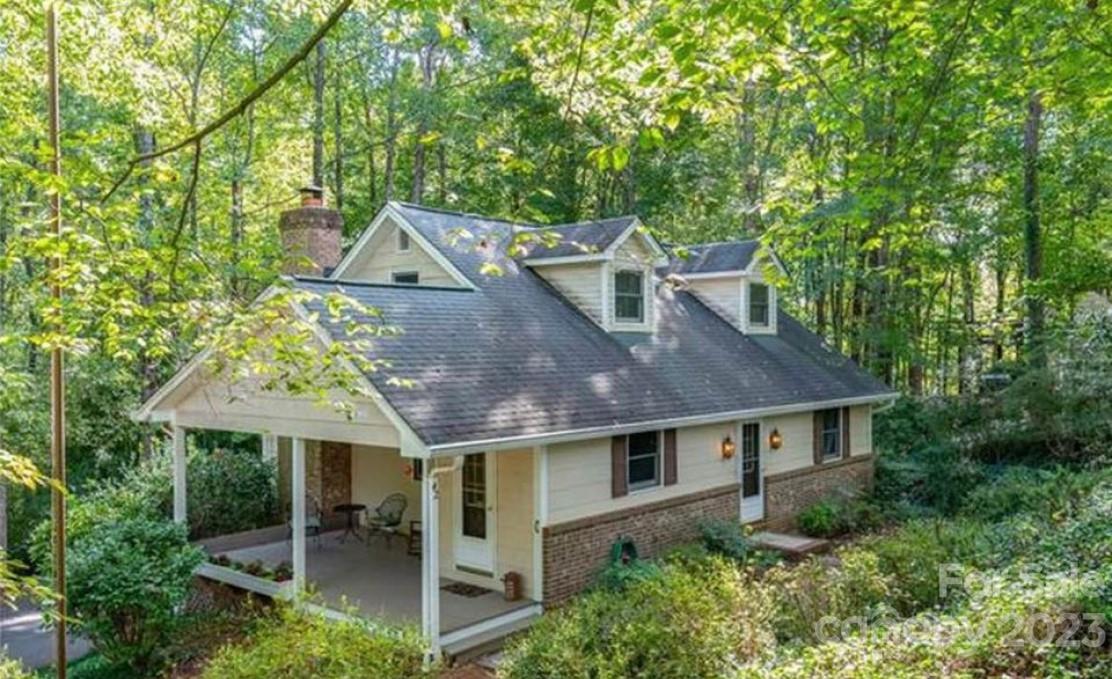 42 Hunter's Trail Tryon, NC 28782 - Photo 1 of 13 an aerial view of house with yard and outdoor seating