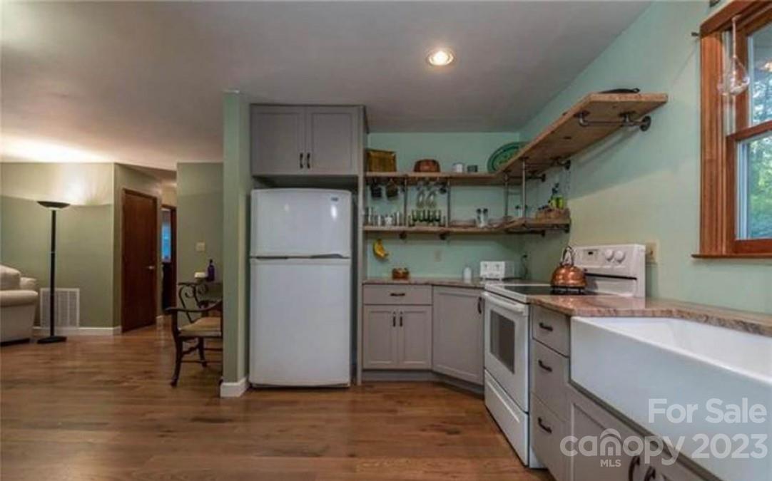 42 Hunter's Trail Tryon, NC 28782 - Photo 2 of 13 a kitchen with stainless steel appliances granite countertop a refrigerator and a stove