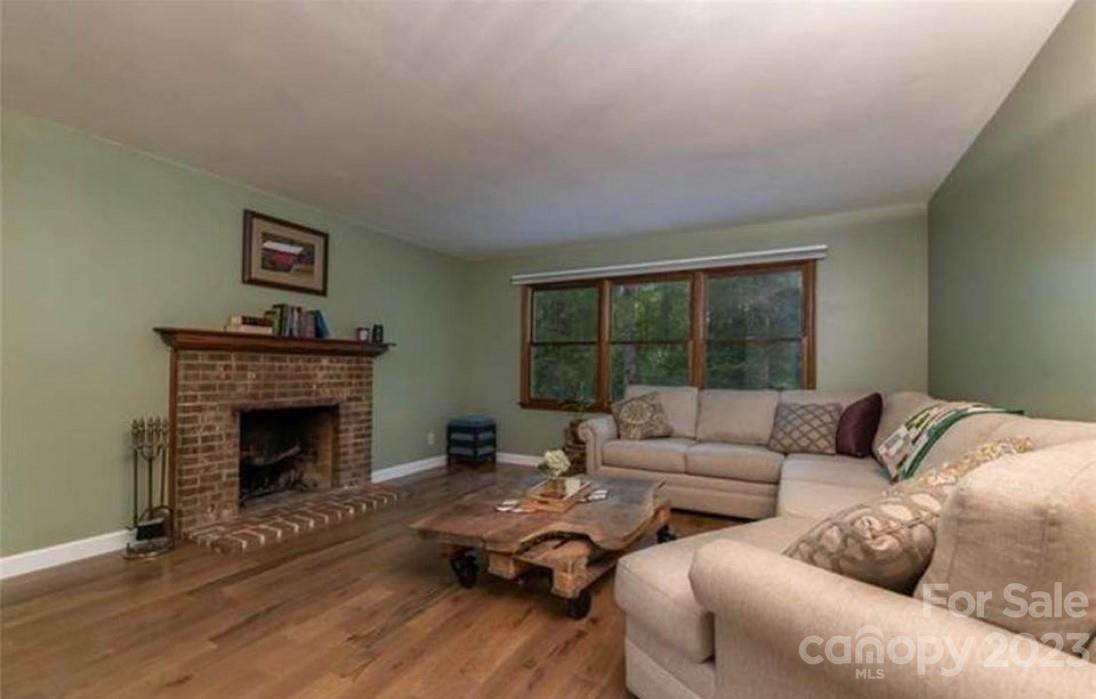 42 Hunter's Trail Tryon, NC 28782 - Photo 5 of 13 a living room with furniture large window and a fireplace
