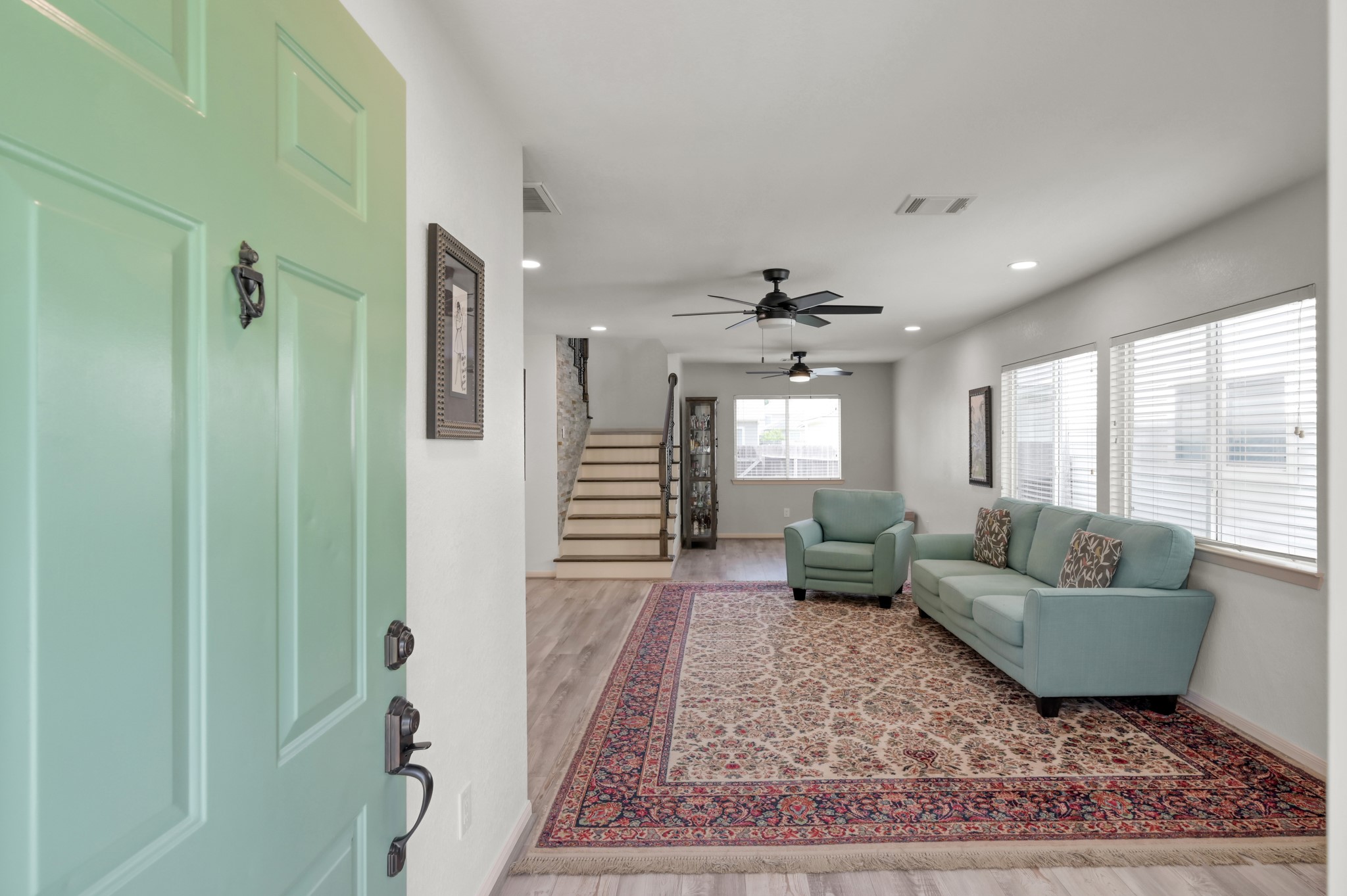 21815 Mossy Field Lane Spring, TX 77388 - Photo 4 of 39 Welcoming entry opens to a spacious open-concept living and dining area with abundant natural light.
