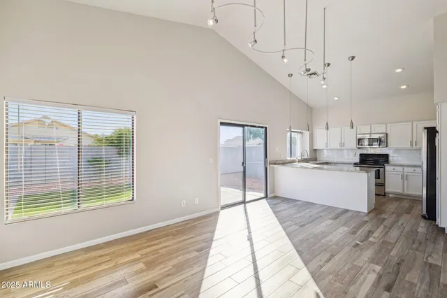 a view of a house with a tree in the background
