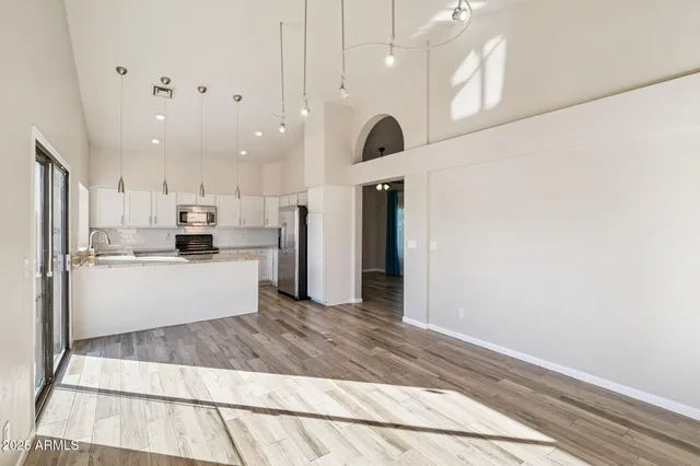 a view of a kitchen cabinets and wooden floor