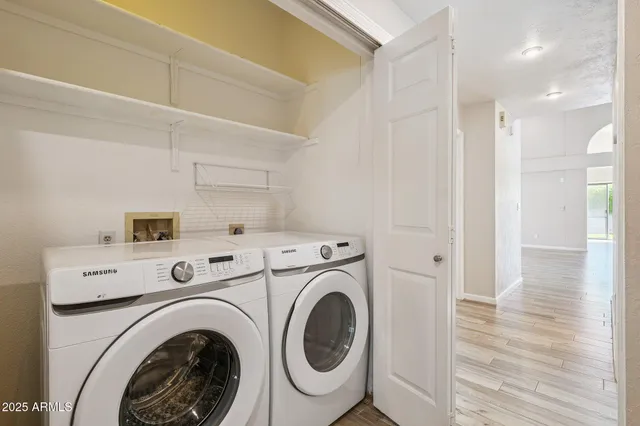 a view of an empty room and wooden floor