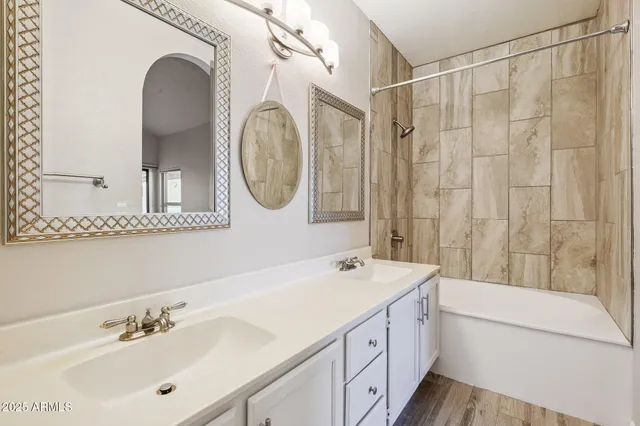 a view of washer and dryer with kitchen in the background