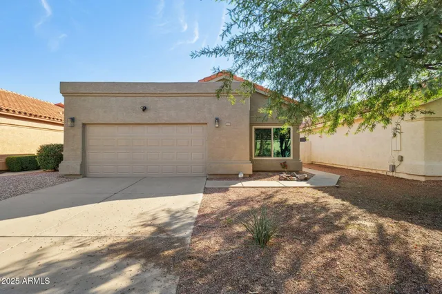 a bathroom with a double vanity sink mirror and shower