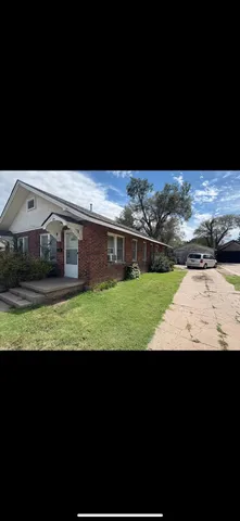 a view of a yard with an outdoor space