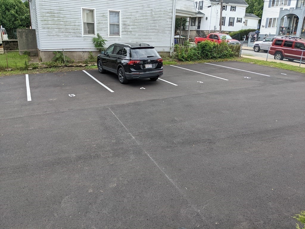 511 Buffinton Street, Unit A Fall River, MA 02721 - Photo 3 of 15 a car parked on the side of a street