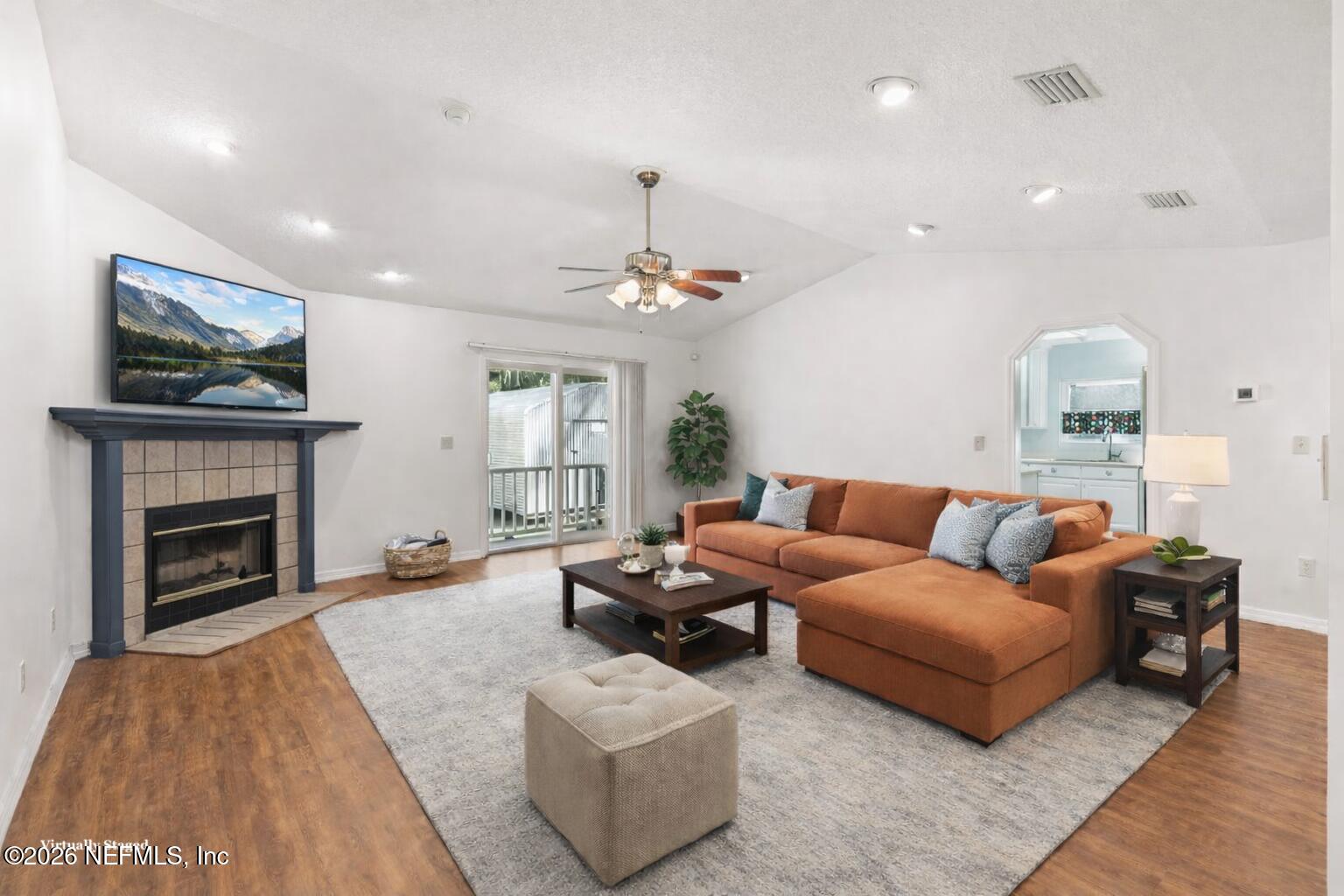 120 Stokes Landing Road St. Augustine, FL 32095 - Photo 10 of 78 a living room with furniture and a fireplace