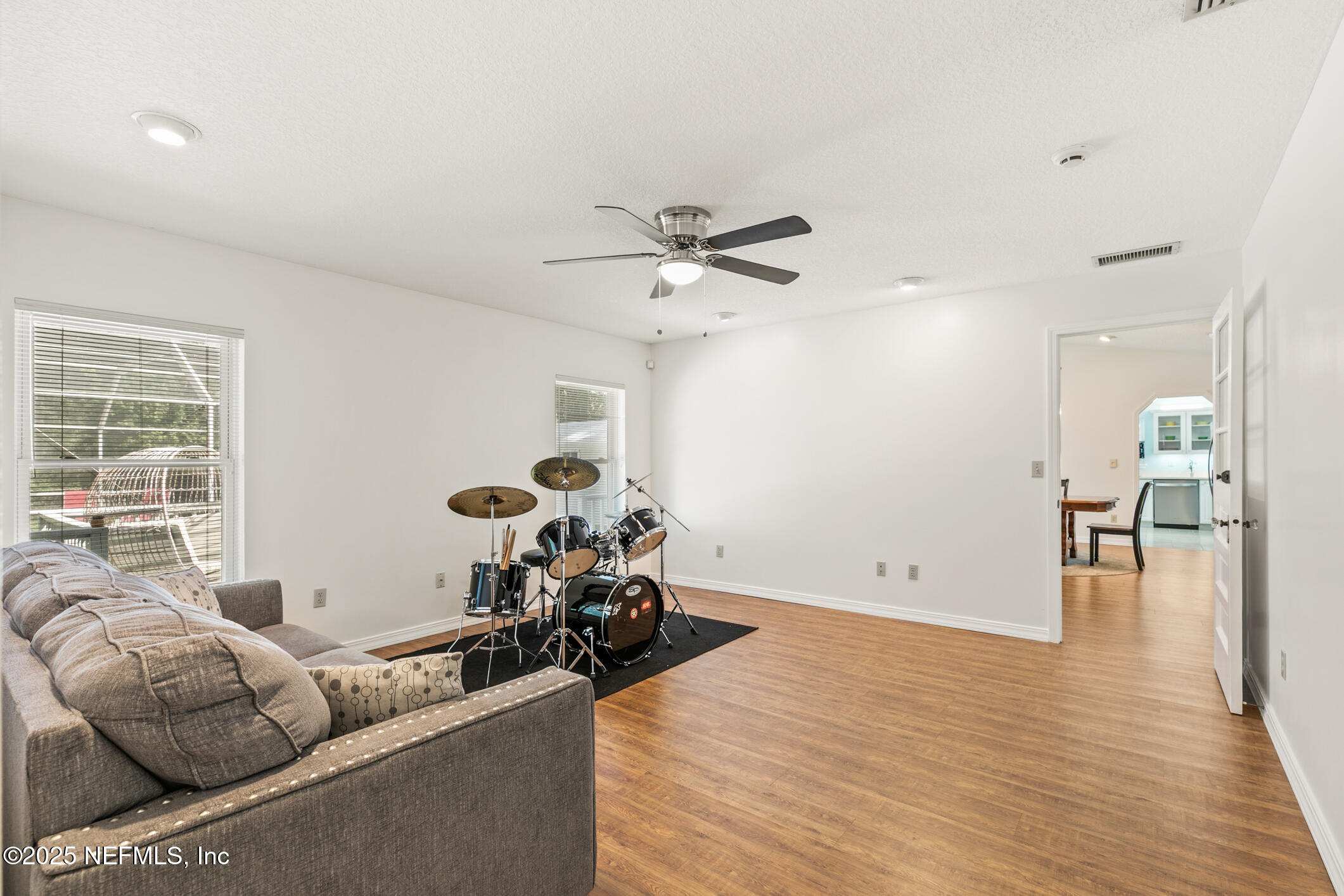 120 Stokes Landing Road St. Augustine, FL 32095 - Photo 11 of 78 a living room with furniture and wooden floor