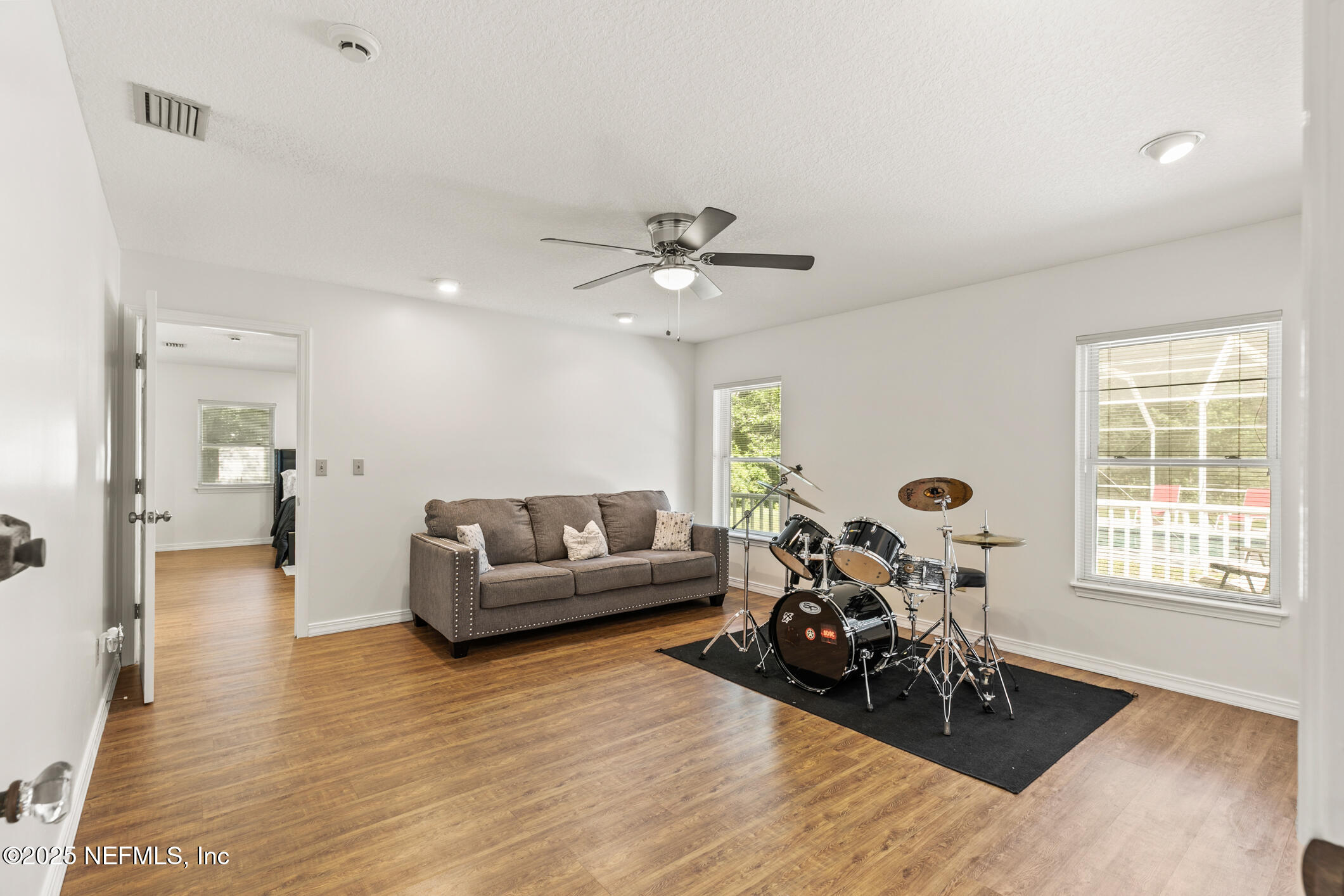120 Stokes Landing Road St. Augustine, FL 32095 - Photo 13 of 78 a living room with furniture and wooden floor