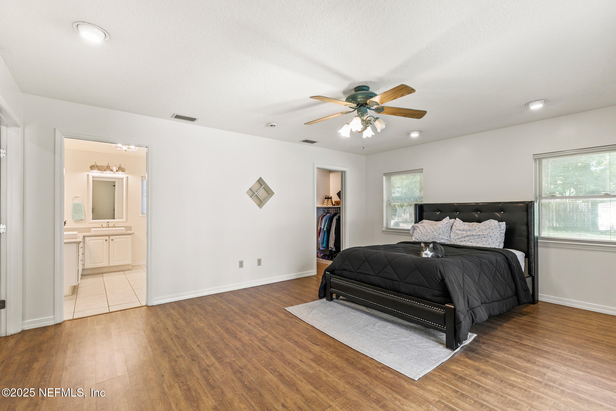 120 Stokes Landing Road St. Augustine, FL 32095 - Photo 14 of 78 a spacious bedroom with a bed and a ceiling fan