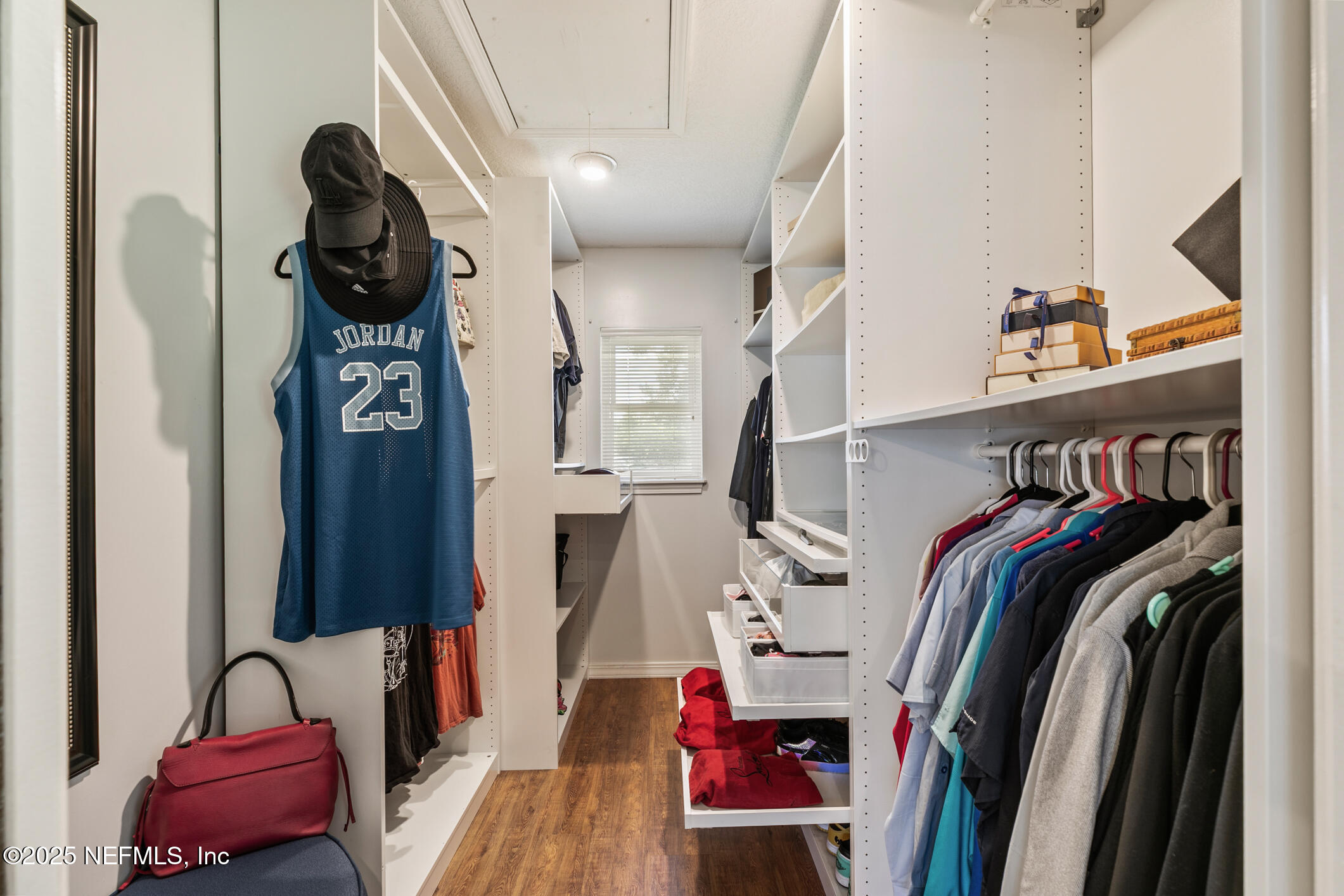120 Stokes Landing Road St. Augustine, FL 32095 - Photo 17 of 78 a view of walk in closet with clothes and shoes