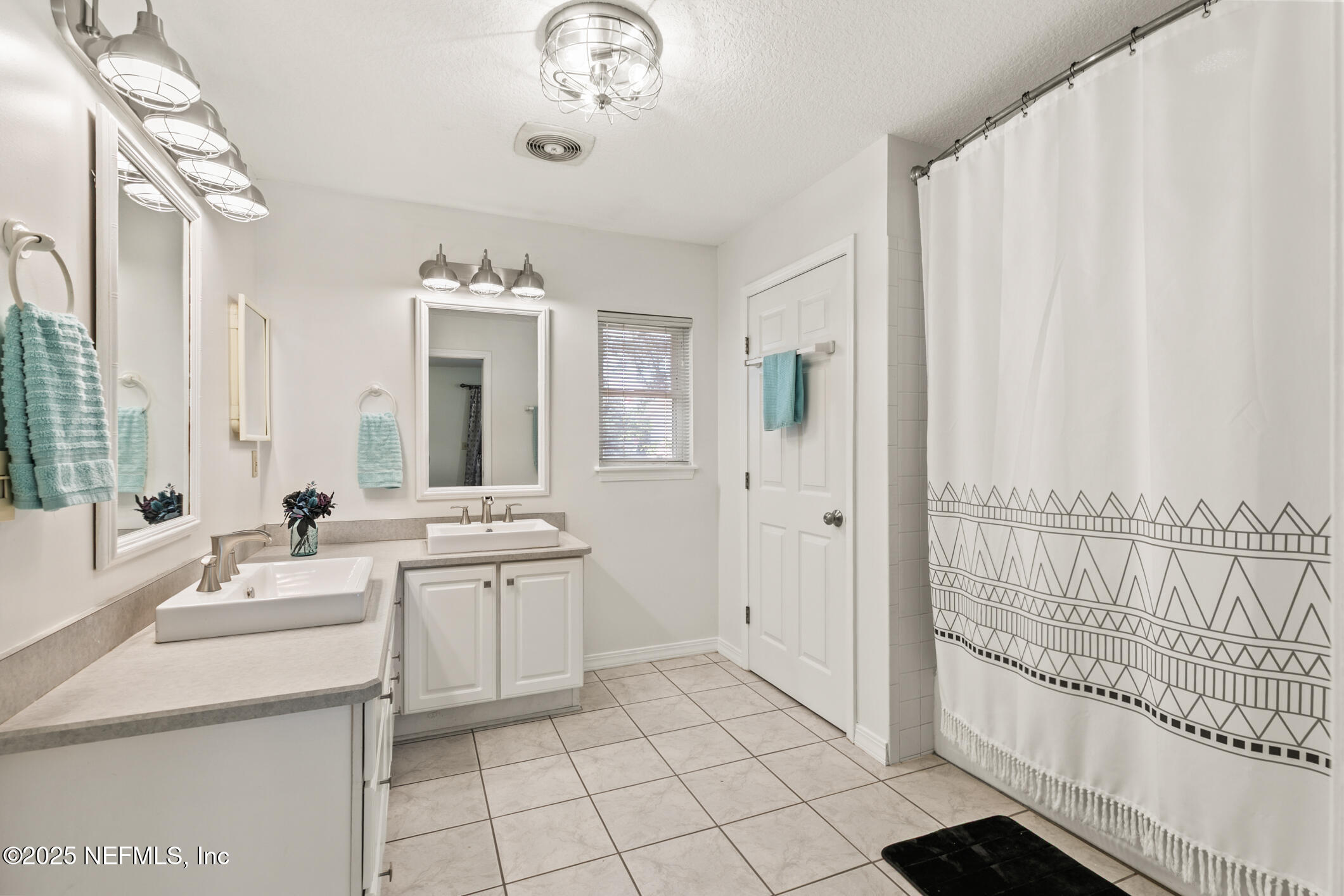 120 Stokes Landing Road St. Augustine, FL 32095 - Photo 19 of 78 a large white kitchen with a sink and cabinets