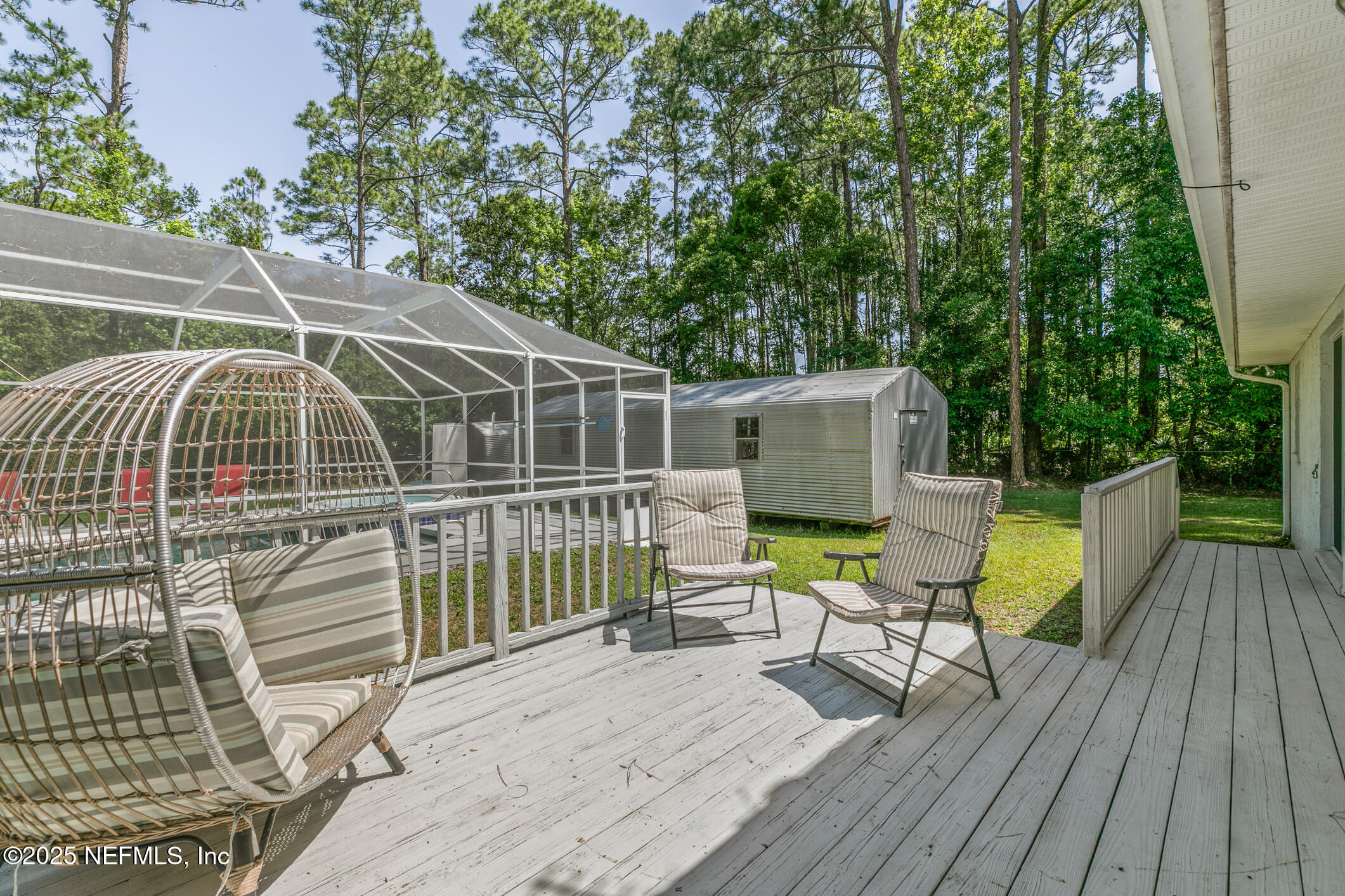 120 Stokes Landing Road St. Augustine, FL 32095 - Photo 41 of 78 a view of a deck with chairs and wooden floor