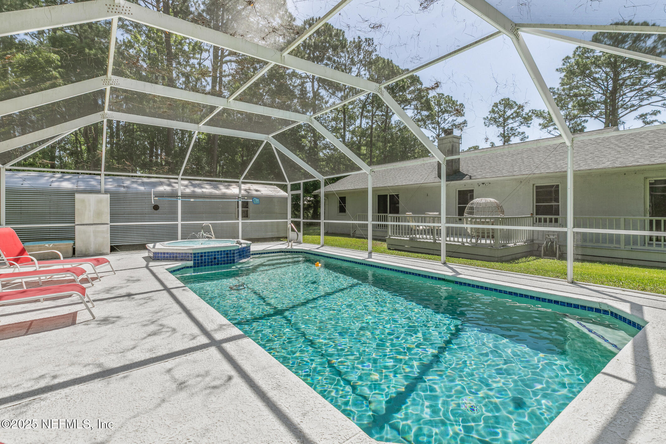 120 Stokes Landing Road St. Augustine, FL 32095 - Photo 45 of 78 a view of a backyard with a swimming pool