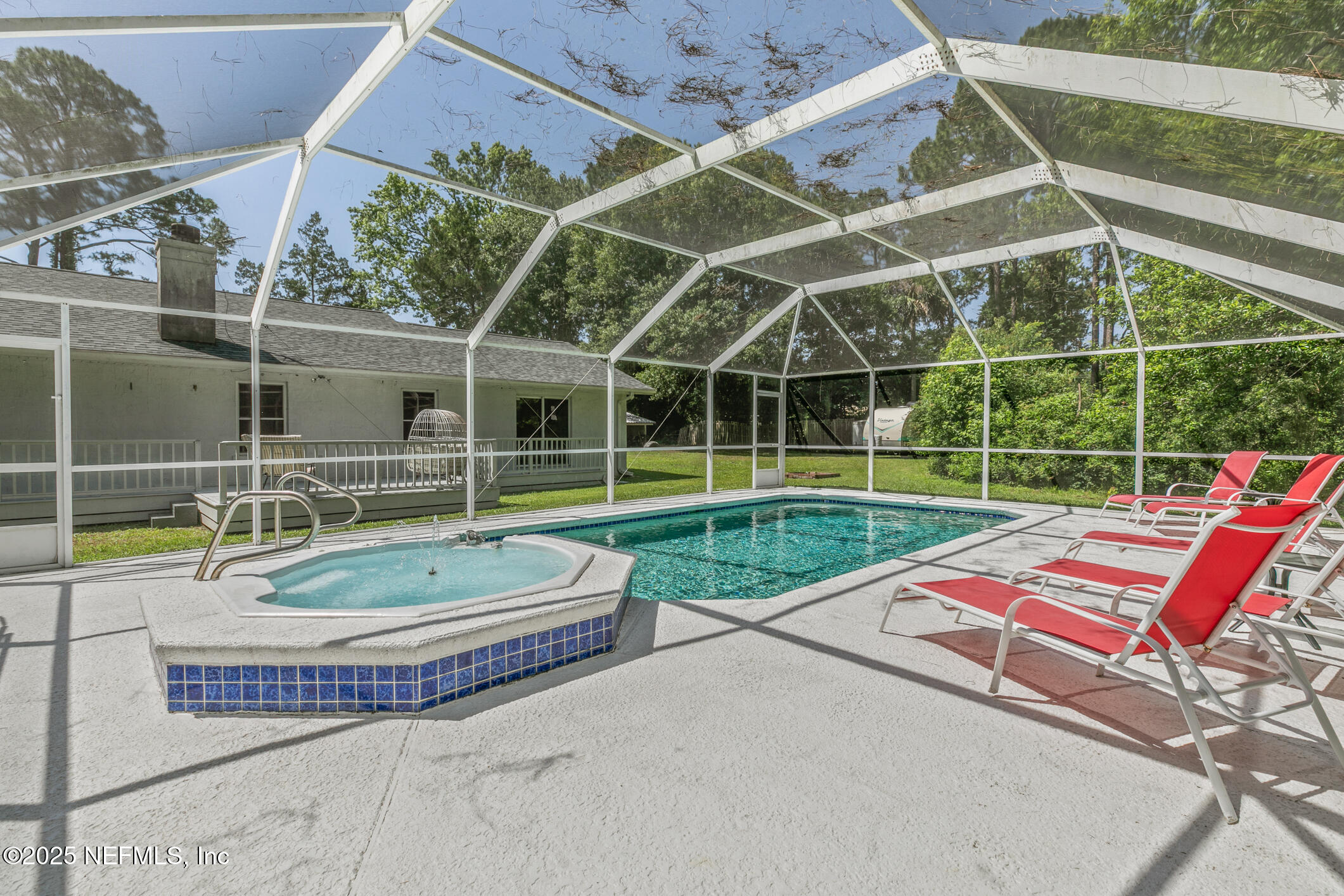 120 Stokes Landing Road St. Augustine, FL 32095 - Photo 46 of 78 a view of a backyard with a table and chairs