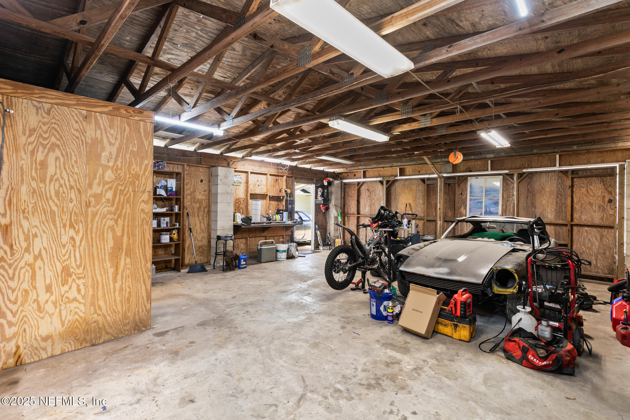 120 Stokes Landing Road St. Augustine, FL 32095 - Photo 48 of 78 a view of a storage room with lots of stuff