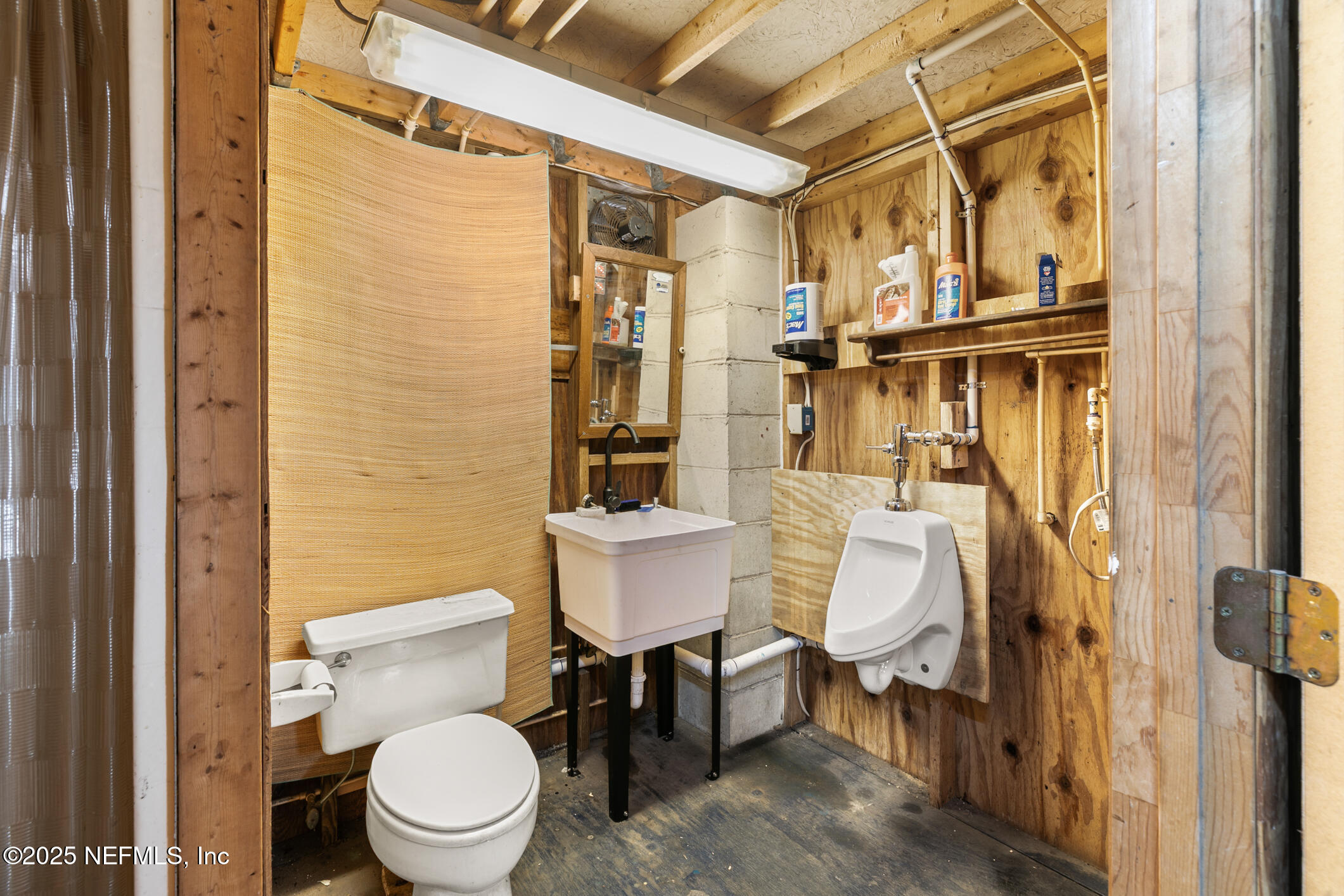 120 Stokes Landing Road St. Augustine, FL 32095 - Photo 50 of 78 a white toilet sitting next to a bathroom sink