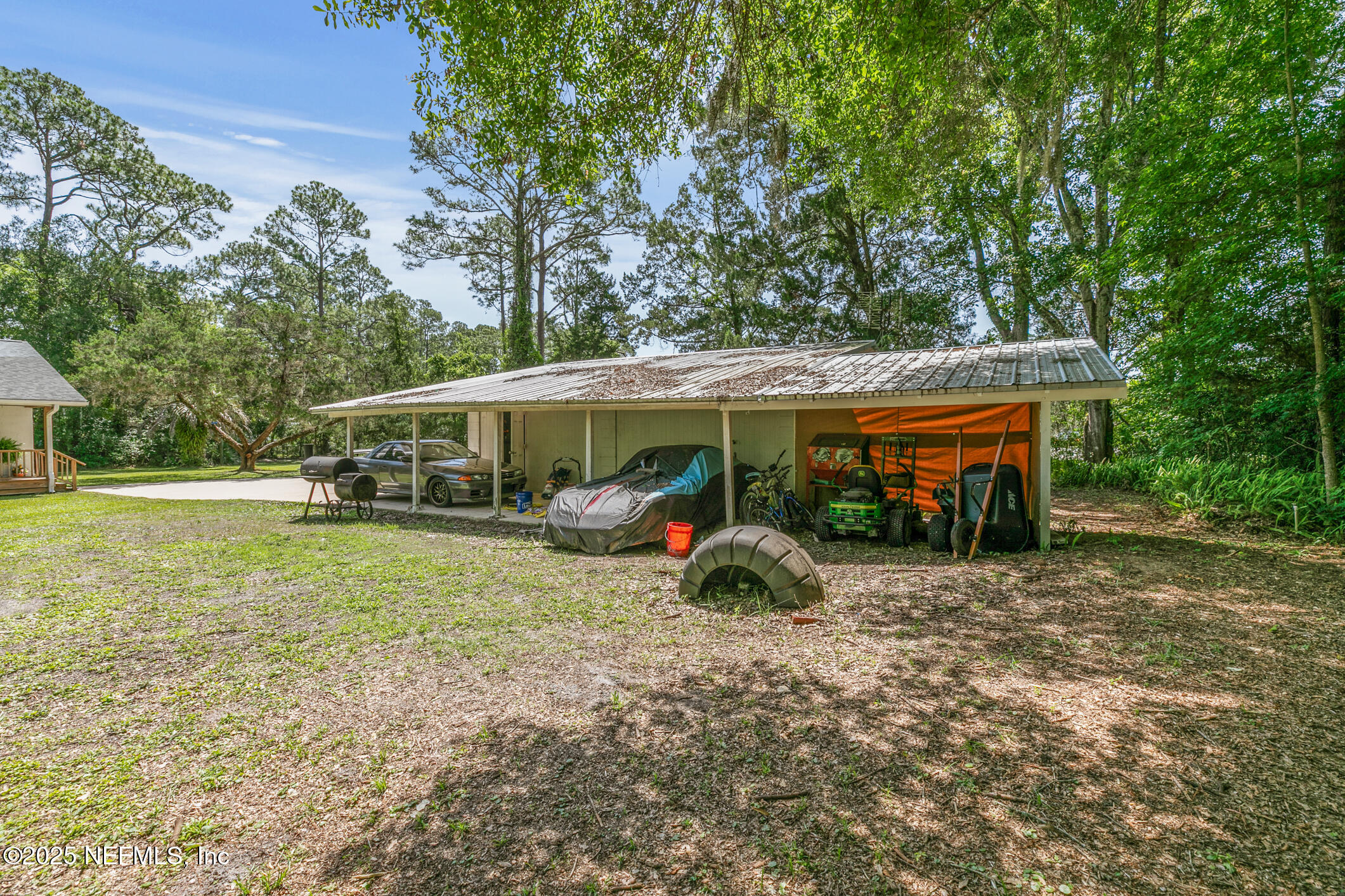 120 Stokes Landing Road St. Augustine, FL 32095 - Photo 51 of 78 a view of a house with backyard sitting area and garden