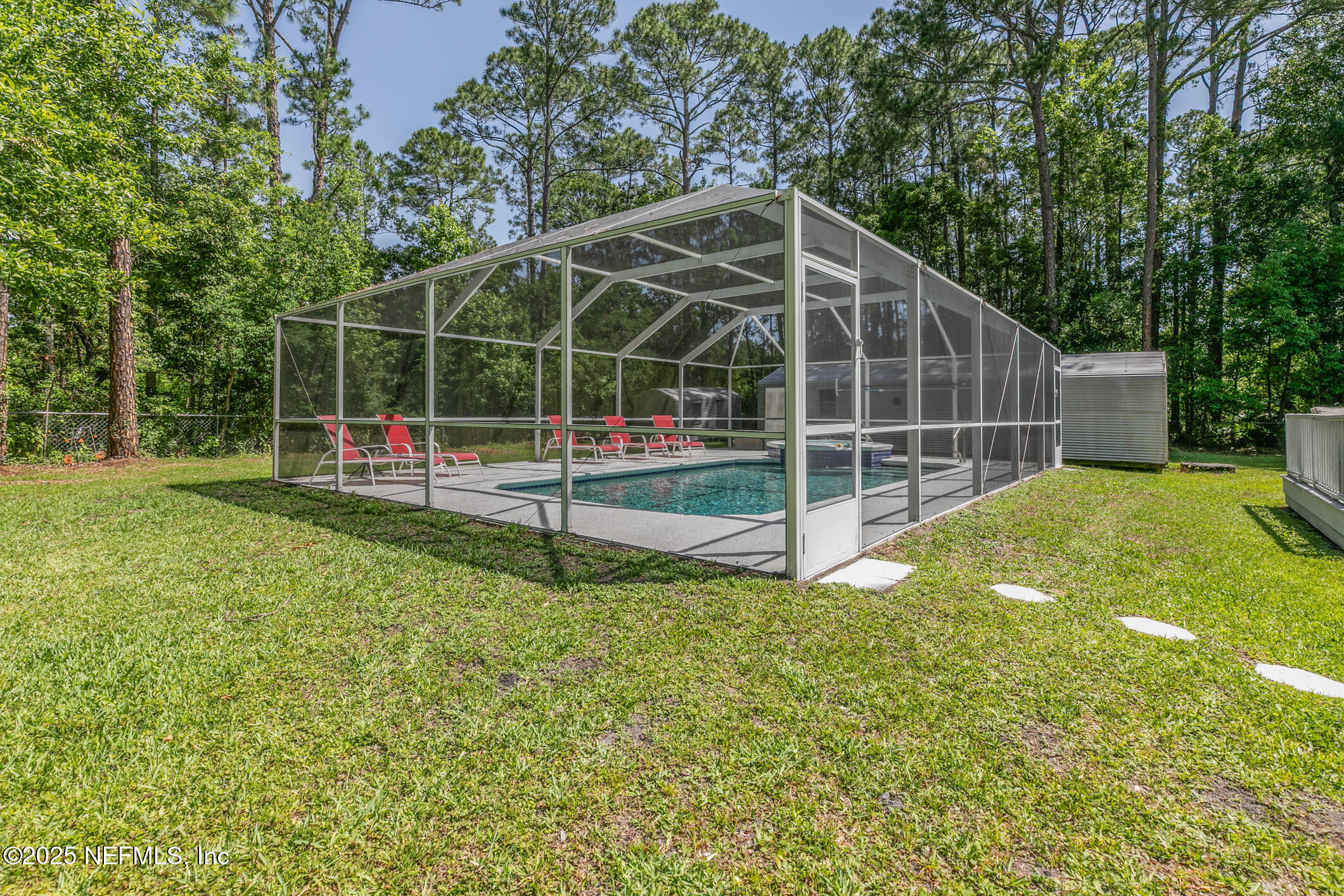 120 Stokes Landing Road St. Augustine, FL 32095 - Photo 54 of 78 a view of a backyard with swings and plants