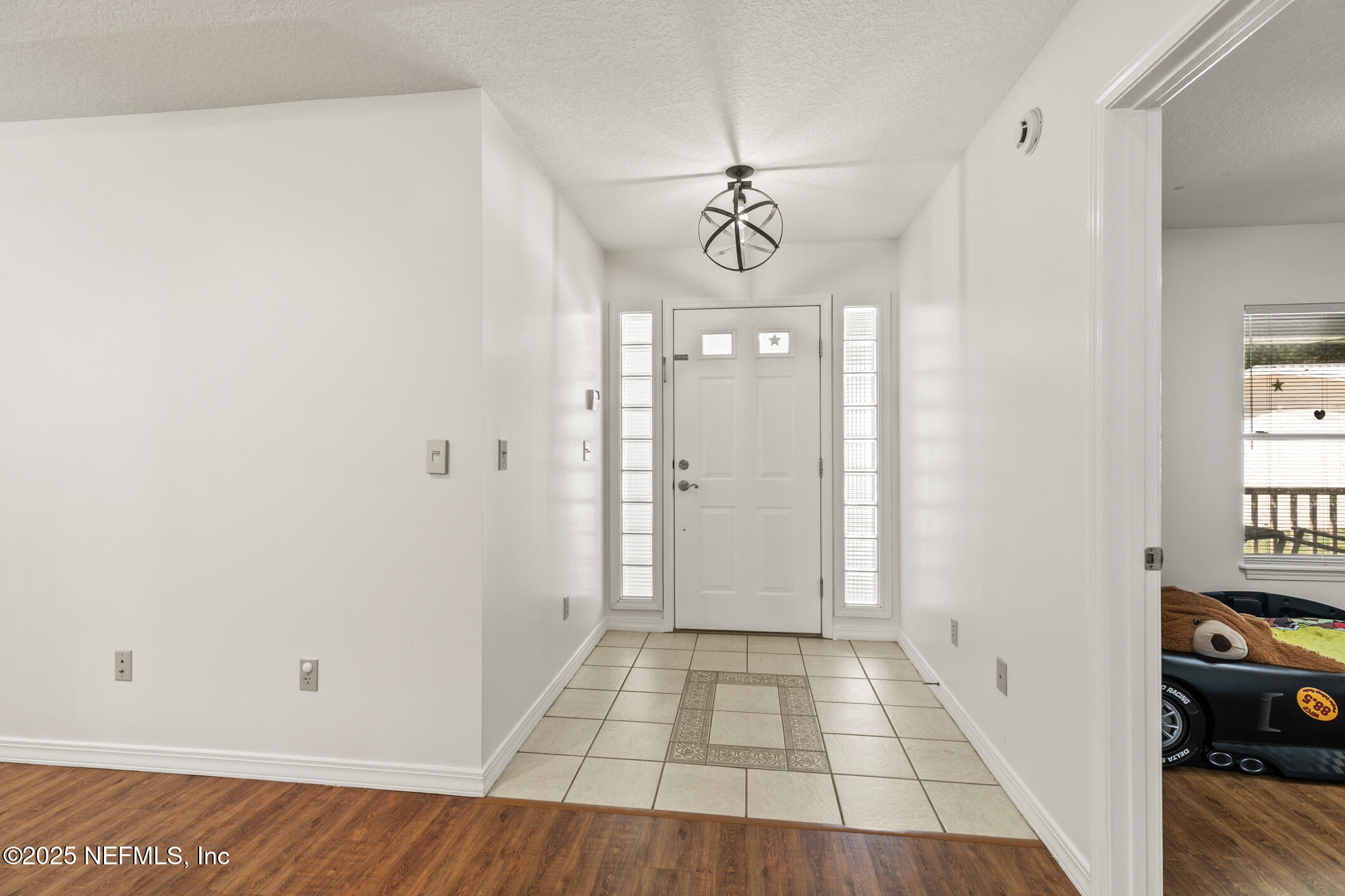 120 Stokes Landing Road St. Augustine, FL 32095 - Photo 5 of 78 a view of a hallway with wooden floor and workspace
