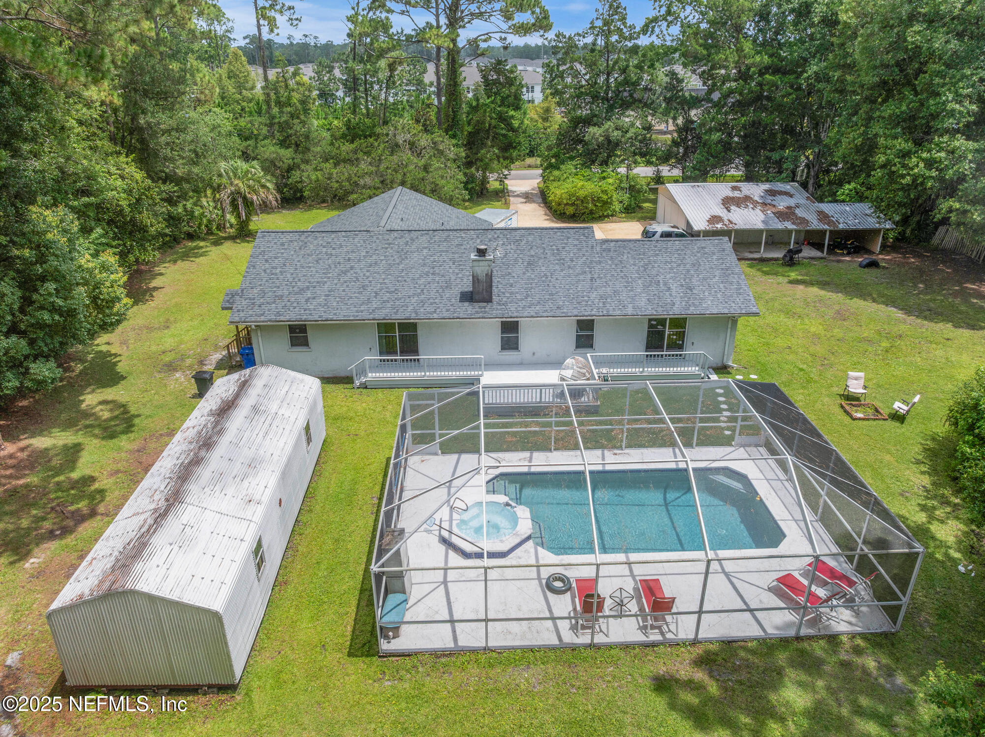 120 Stokes Landing Road St. Augustine, FL 32095 - Photo 71 of 78 an aerial view of a house with swimming pool garden and patio