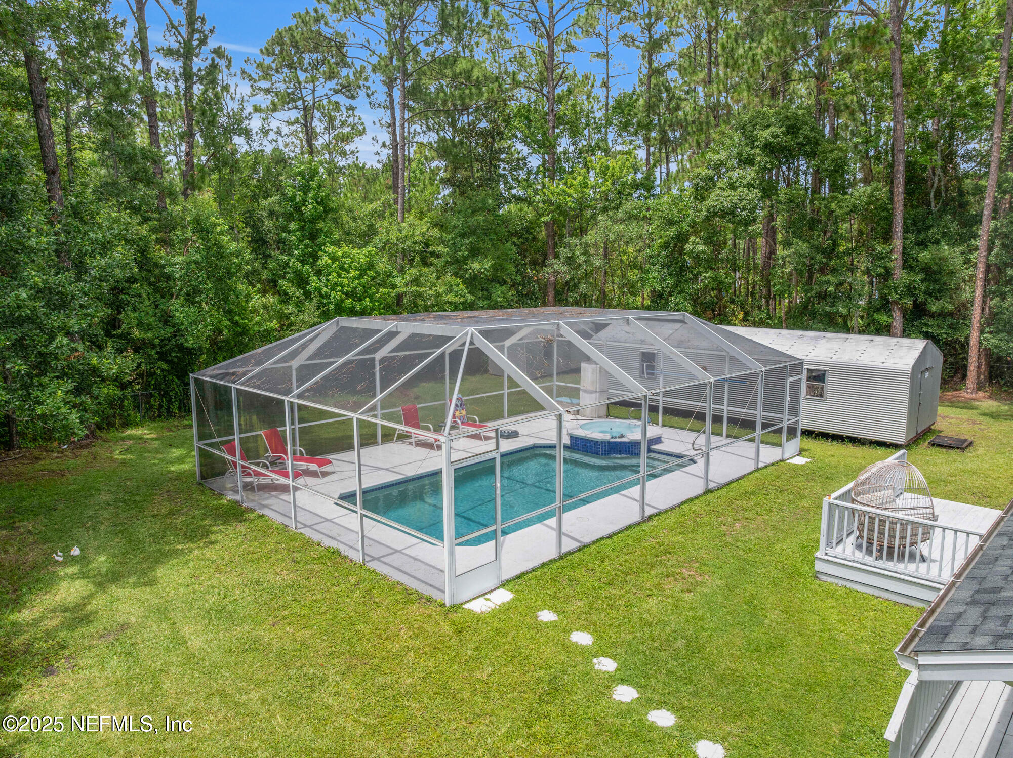 120 Stokes Landing Road St. Augustine, FL 32095 - Photo 74 of 78 a view of a house with a big yard and large trees