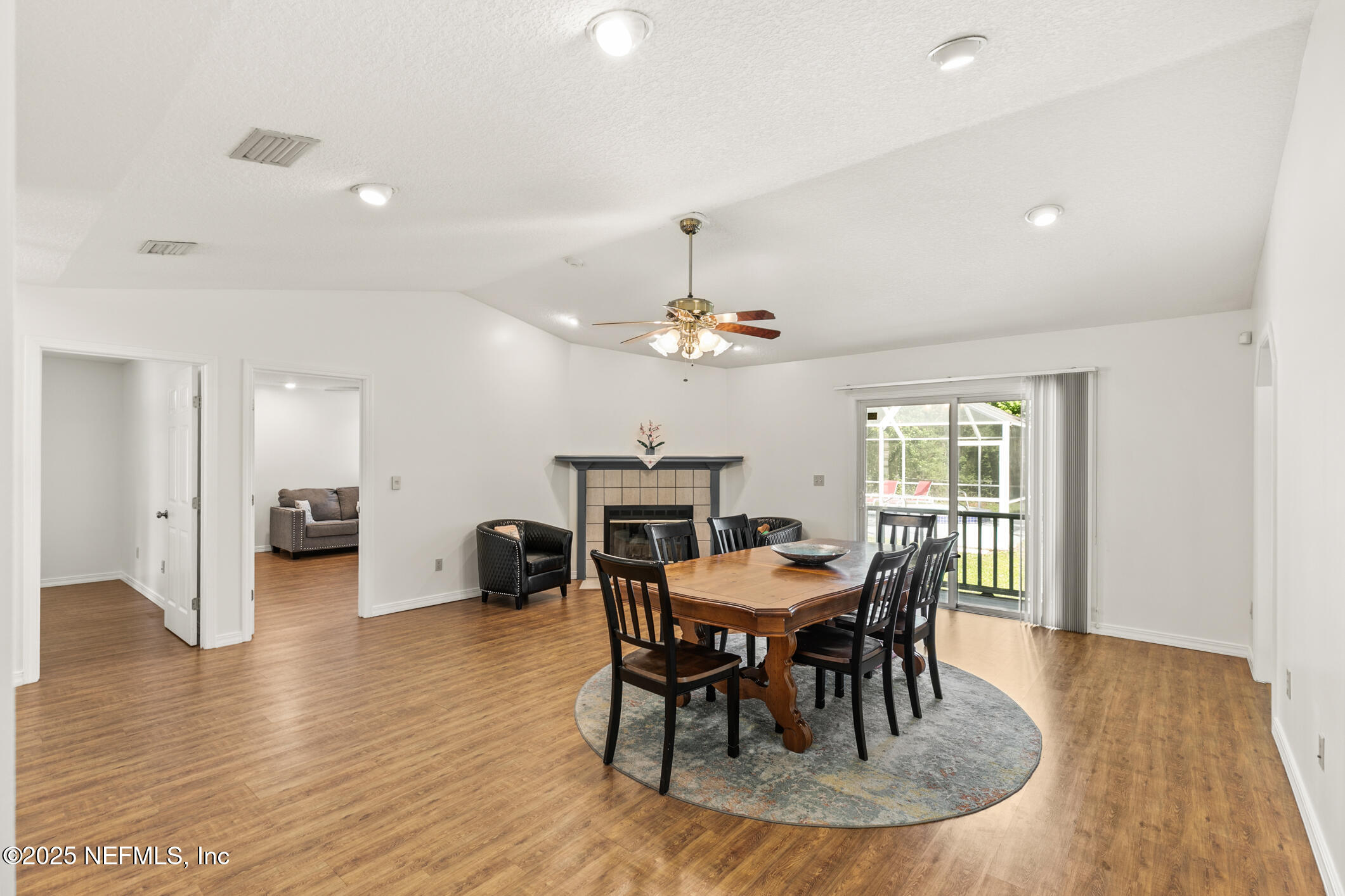 120 Stokes Landing Road St. Augustine, FL 32095 - Photo 8 of 78 a dining room with furniture a chandelier and wooden floor