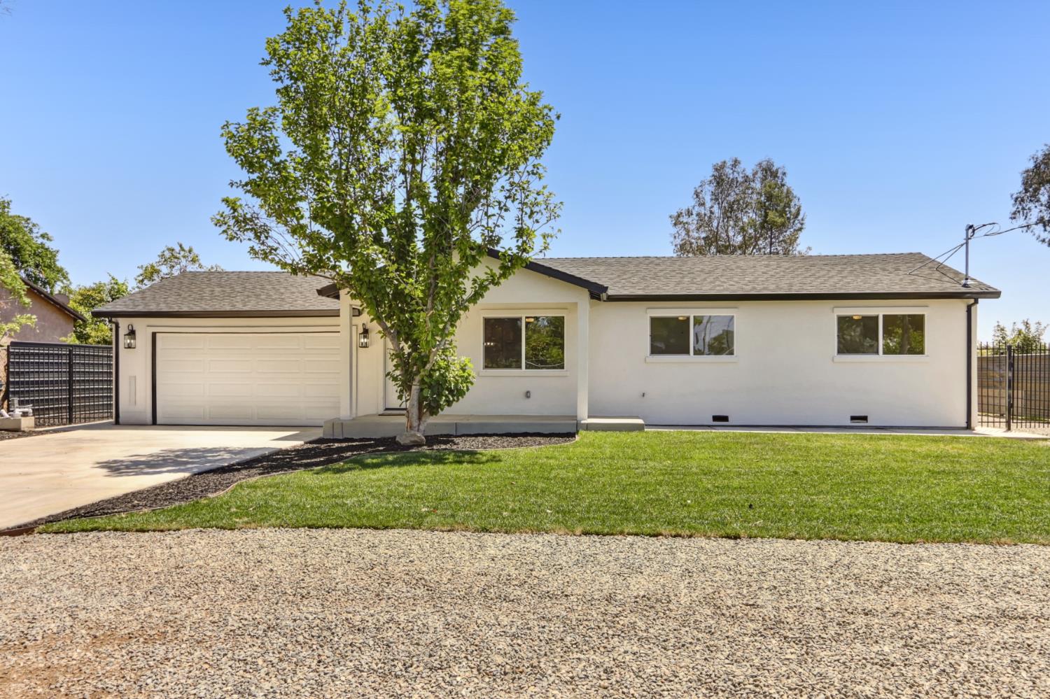510 U Street Rio Linda, CA 95673 - Photo 1 of 1 a front view of a house with a garden and yard