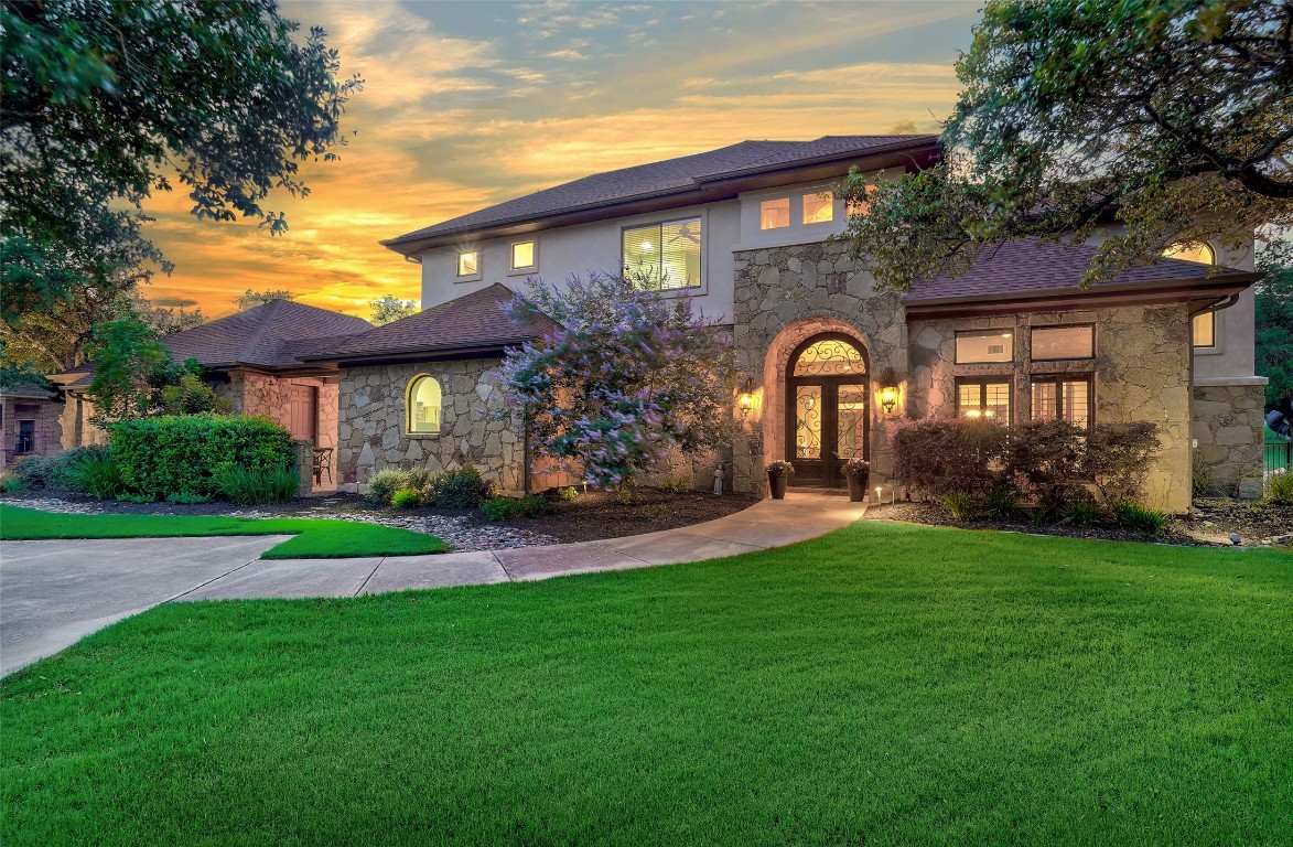 a front view of a house with garden