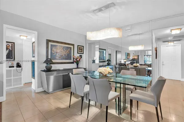 a dining area with furniture and window