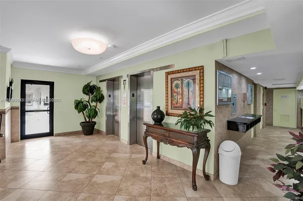 a view of a livingroom with furniture and a potted plant