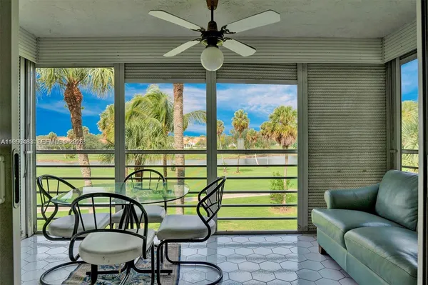 a room with furniture and a painting on the wall