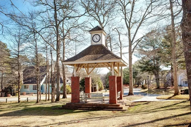a view of street with houses on the side of road
