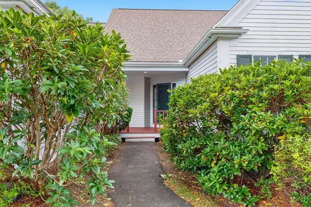 a view of a pathway in front of house