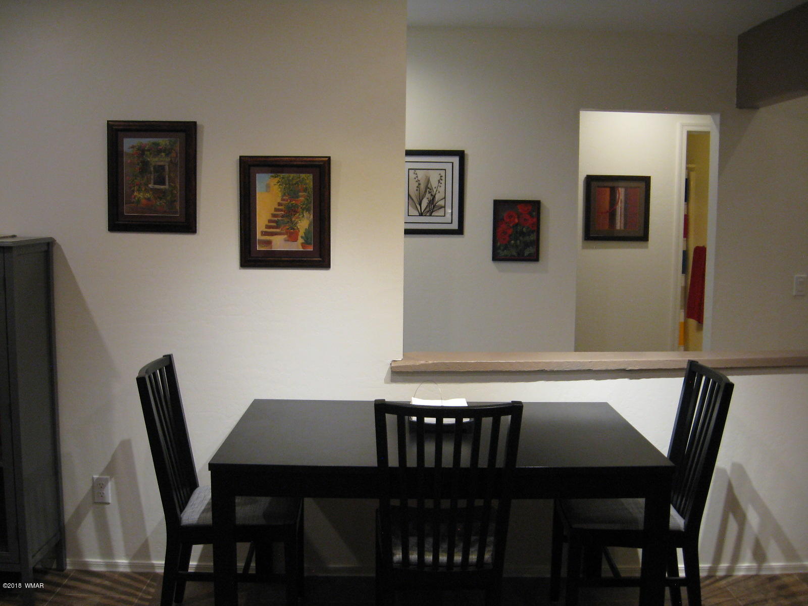 4639 Buck Springs Road Pinetop, AZ 85935 - Photo 17 of 19 a view of a dining room with furniture and wooden floor