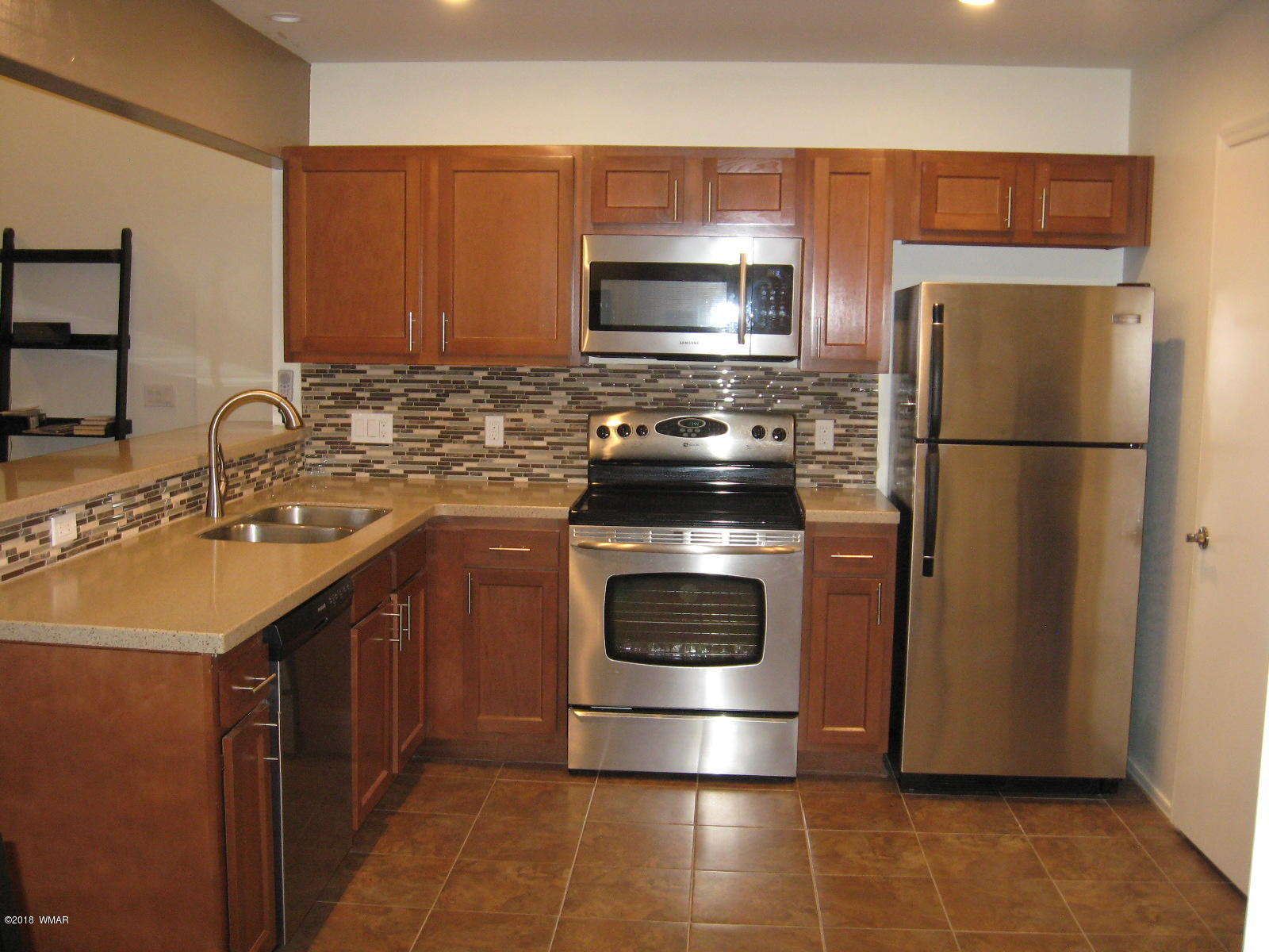 4639 Buck Springs Road Pinetop, AZ 85935 - Photo 2 of 19 a kitchen with a refrigerator sink and stove