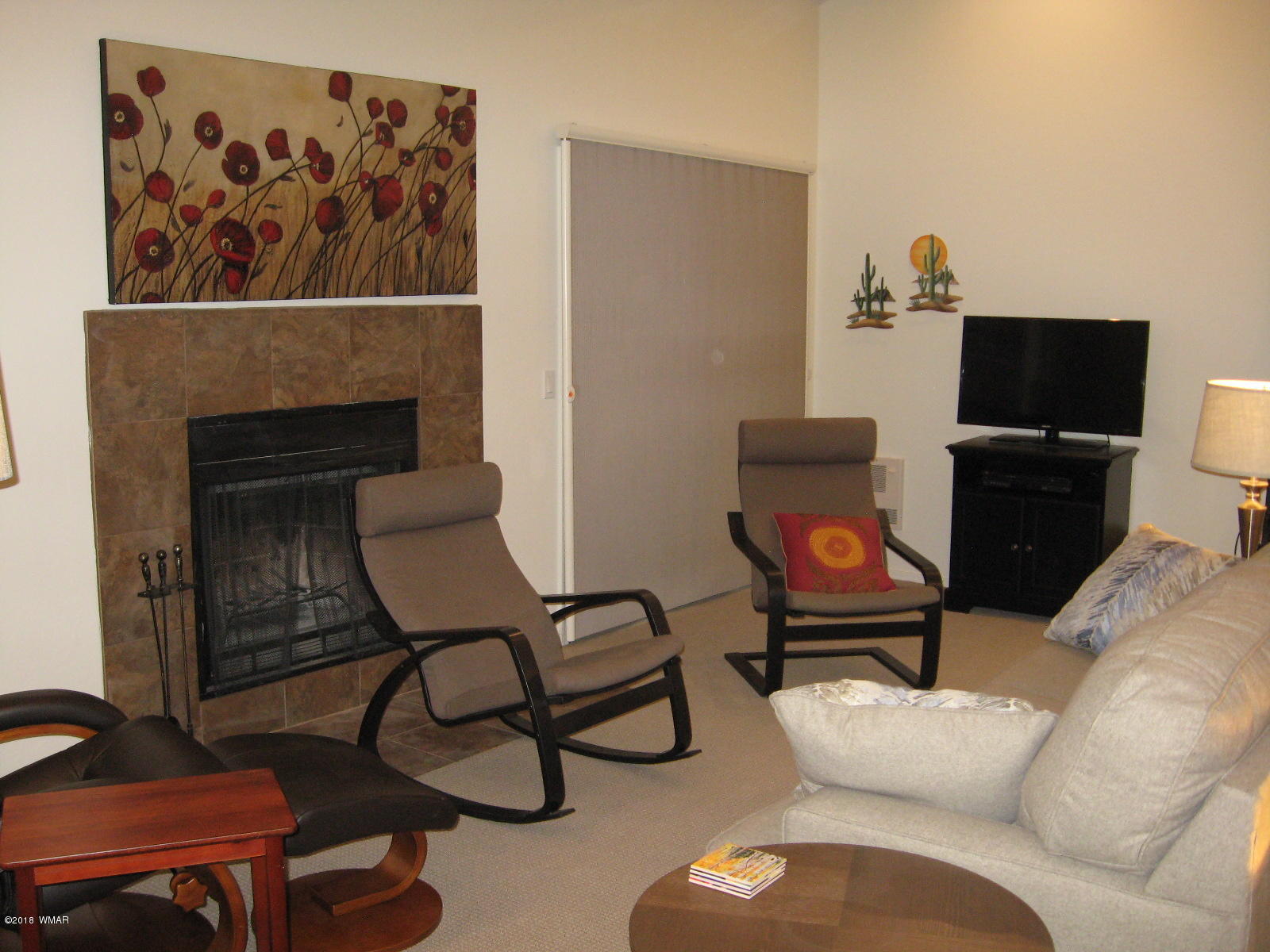 4639 Buck Springs Road Pinetop, AZ 85935 - Photo 4 of 19 a living room with furniture and a fireplace