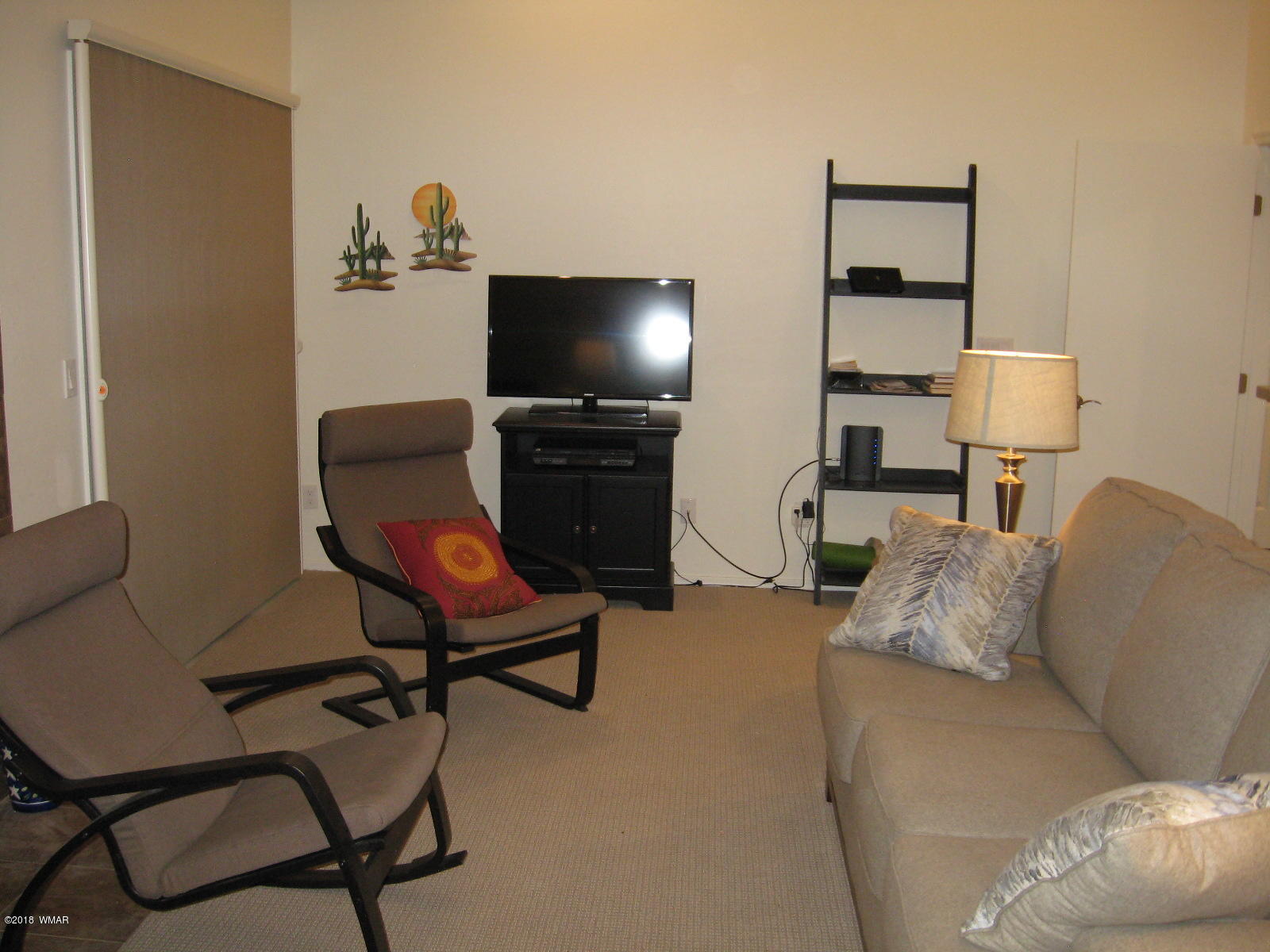 4639 Buck Springs Road Pinetop, AZ 85935 - Photo 9 of 19 a living room with furniture and a flat screen tv