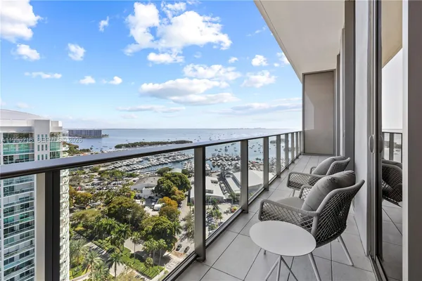 a view of a balcony with furniture