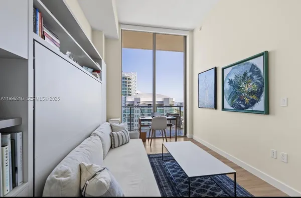 a living room with furniture and a window