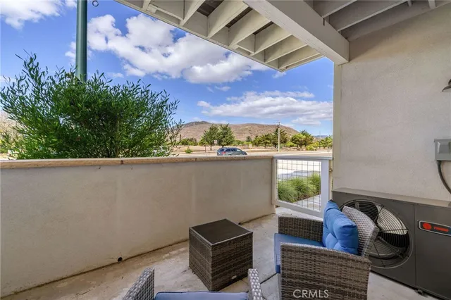 a view of balcony with furniture