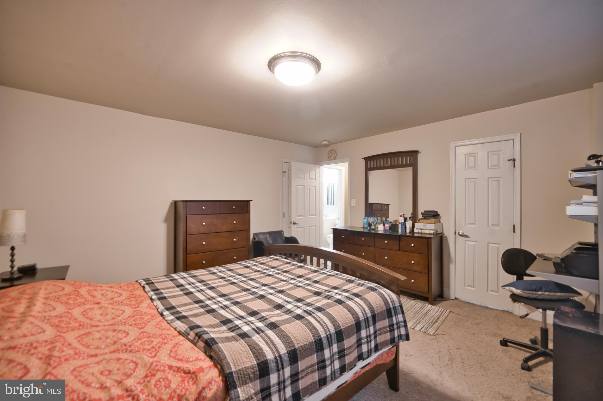 1005 Chillum Road, Unit 117 Hyattsville, MD 20782 - Photo 16 of 16 a bedroom with a bed and a desk